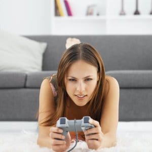Competitive boyfriend and girlfriend playing video games funny Stock Photo